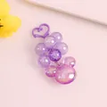 Close-up of iridescent purple grape bead keychain with mickey head and heart clasp - Purple
