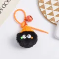 Detail shot of black pom-pom keychain with orange knit hat and bell on bag - Black Soot Sprite Style (5216-1)