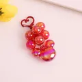 Detail of Mickey-shaped acrylic bead keychain with heart-shaped hook and laser gradient effect - Red