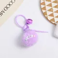 Macro detail of a purple plush keychain ball with big eyes, bell, and silicone lanyard - Purple Style (5216-8)