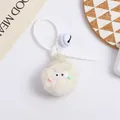 Detail of white plush pompom keychain with cute eyes, tiny bell and silicone strap - White Style (5216-5)