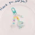 Close-up of pastel beaded keychain with light green moon charm and colorful heart beads - Light Blue (yc5230-1)