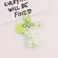 Luminous pale green teddy bear keychain with iridescent resin finish and heart charm - Pale Green