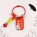 Close-up of lucky rabbit keychain with red metal tag and colorful decorative beads - Everything Goes Well Rabbit (yc5243-1)