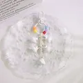 Detail of white duck charms keychain with resin smile blocks and plastic chain link - White