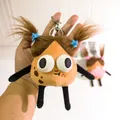 Detail of fuzzy brown potato plush keychain with blue star clips and big eyes - Big Eyes Blue Star Hairclip Style (yc5278-2)