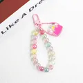 Detail of colorful acrylic beaded keychain with iridescent beads and a pink lobster clasp - Magenta Crown
