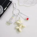 Detailed cream balloon dog keychain with faux pearls, colorful beads and acrylic links - Off White