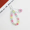 Close-up of macaron color beads with transparent star pendant and black smiley face detail - Star Smiley Face