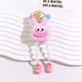 Close-up of pink plush monster keychain with big eyes and sausage lips on white stand - Pink Monster Style (yc5281-2)