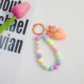 Llavero de pulsera con cuentas de colores, lazo naranja y colgante de corazón - Naranja