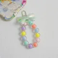 Sweet macaron beaded keychain with iridescent translucent bow and silver metal clasp - Green