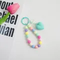 Bunte Perlen-Handgelenkschlaufe mit pastellfarbenem Herzanhänger und weißer Schleife - See Blau