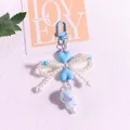 Detail of blue heart keychain with white pearl bow and iridescent bead charm pendant - Blue Bow Style(yc5294-2)