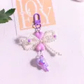 Close-up of purple heart and pearl bow keychain with iridescent bead detail - Purple Bow Style(yc5294-5)