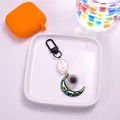 Detail of cute cloud and moon keychain with metallic gradient finish and tiny flowers - Black