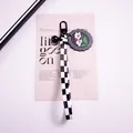Detail of checkerboard strap keychain with black bell and floral acrylic charm - White Double Flower (yc5305-6)
