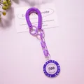 Detail of purple spiral spring keychain with poker chip pendant and plastic links - Purple (Value 500)