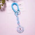 Close-up of blue spiral spring keychain with Monte Carlo Poker Club acrylic pendant - Blue (Value 1)