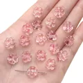 Handheld view of small pink translucent glass flower beads for DIY jewelry making - Watermelon Pink