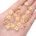 Translucent gold four-leaf clover glass beads with sparkling foil for DIY jewelry making - Light Burgundy Champagne