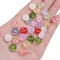 Colorful clover-shaped glass beads for DIY jewelry making held in a palm for size scale - Random Mixed Colors