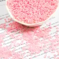 DIY translucent pink glass seed beads in a white bowl for jewelry making crafts - 2mm 15g Pack Approx 1000 Count / Light Pink