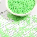 Light green glass seed beads for DIY jewelry making in a decorative white tray - Light Green