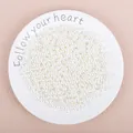 Loose white ABS imitation pearl beads with holes for DIY jewelry making and crafting - Off White