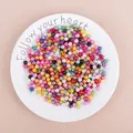 Colorful mixed ABS imitation pearls in a white dish for DIY jewelry making and beads crafts - Multicolor