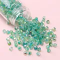 Aurora green 4mm faceted glass bicone beads with iridescent finish for DIY jewelry - Green