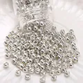 Silver glass seed beads in a transparent jar for DIY jewelry making and bracelets - Style #16