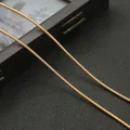Macro shot of 1.8mm bronze spiral metal spring wire for DIY jewelry and hairpins - 20cm / KC Gold