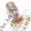Vibrant mixed color glass seed beads in a clear bottle for DIY jewelry making - Silver-lined Mixed Color
