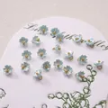 Light blue lily of the valley resin flower charms with gold centers and metal loops - 7mm / Five-petal Flower Light Blue