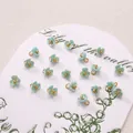 Light blue lily of the valley resin charm with iridescent finish and gold ring connector - 6mm / Three-petal Flower Blue AB