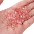 Irregular pale pink glass stone beads for DIY jewelry making held in palm - Watermelon red