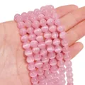 Polished 8mm pink cat eye stone beads for DIY jewelry making held by model - 8mm Pink (1 Strand/Pack, approx. 50 Beads)