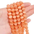 Handheld strand of polished orange-pink cat eye round beads for DIY jewelry making - 10mm Orange (1 Strand/Pack, approx. 40 Beads)