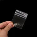 Durchsichtige PVC-Minispartasche mit Druckverschluss und Aufhängeloch für Schmuck - 5x7cm (20 Stück/Packung) / Transparent