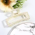 Detailed view of elegant beige pearl hair claw clip with silver spring and floral decor - Curved Rectangle