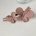 Detail of matte butterfly hair clip in dusty rose pink for bun hairstyles - Pink