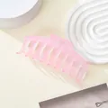Detail view of pink matte translucent large hair claw clip on minimalist display stand - Pink