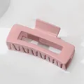 Detailed view of large macaron pink rectangular hair claw clip with cutout design - Pink