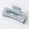Detail shot of the glossy blue rectangle hair claw clip with interlaced teeth - Style W-Q17 / Blue