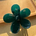 Macro detail of the dark green translucent resin flower hair claw with five rounded petals - Dark Green