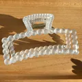 Detail of matte cream white rectangular hair claw clip with golden metal spring mechanism - Matte Blue