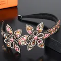 Macro detail of luxury floral headband featuring colorful crystals and anti-slip teeth - Pink