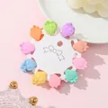 Close-up of strawberry mini hair clips in macaron colors on a white display card - Strawberry Style (C)