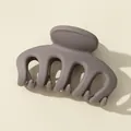 Detail of 7cm matte grey pumpkin hair claw clip showing a frosted finish and strong teeth - Light Gray